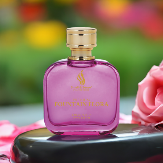 Fountain Flora perfume bottle placed amidst blooming roses with a luxurious and elegant backdrop